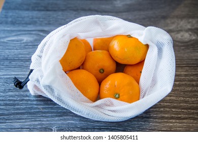 Organic Mandarins Bought From The Local Market In Reusable Produce Bags Made From Upcycling Old Single Use Plastic Bags. Giving Soft Plastic Another Life Is A Sensible Way To Help The Waste Problem.
