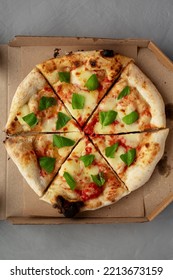 Organic Margarita Pizza With Basil And Mozarella In A Box, Top View. Flat Lay, Overhead, From Above.