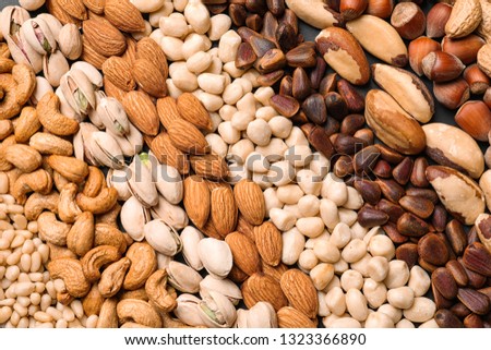 Organic mixed nuts as background, top view