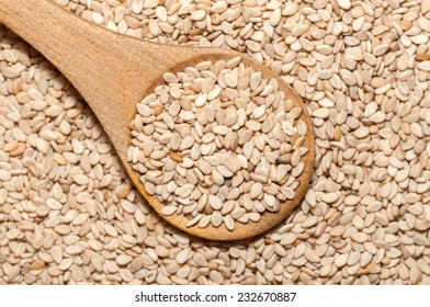 Organic Natural Sesame Seeds On Wooden Spoon