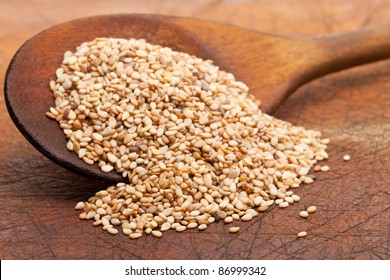 Organic Natural Sesame Seeds On Wooden Spoon