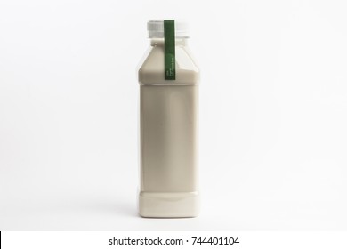 Organic nutty milk nutrition in plastic bottle on the white background. Detox juice diet. Big size bottle - Powered by Shutterstock