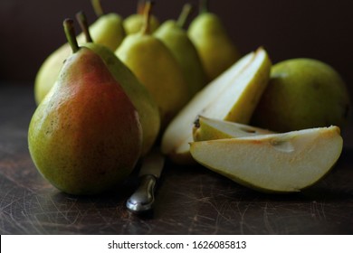 Organic pears 'Conference' on dark wood