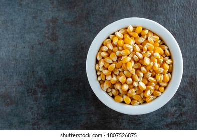 Organic Popcorn In White Bowl.  Overhead View With Horizontal Composition.  Copy Space For Text.