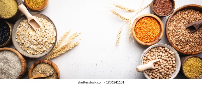 Organic products. Bowls with different gluten free grains on white background, top view - Powered by Shutterstock