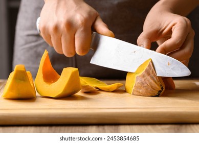 Organic pumpkin cutting on wooden board, Homemade cooking, Food ingredient - Powered by Shutterstock