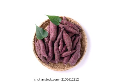 Organic Purple Sweet Potatoes In Basket On White Background, Top View