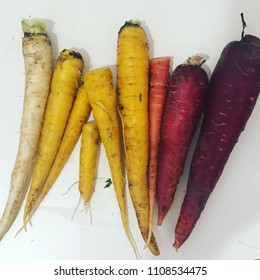 Organic Rainbow Carrots From A CSA Lined Up In A Gradient