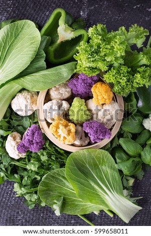 Similar – Image, Stock Photo Various green vegetables on kitchen table with knife