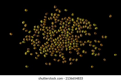 Organic raw green beans mungo (Vigna radiata) isolated on black, top view