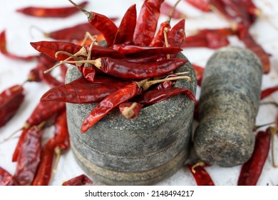 Organic red chili , chilli cayenne pepper Indian spices sun drying whole Kashmiri chilly Kerala India Sri Lanka. make paprika , red chilly powder masala for hot spicy curry, seasoning.