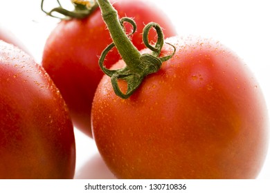 Organic Roma Tomatoes On White Background.