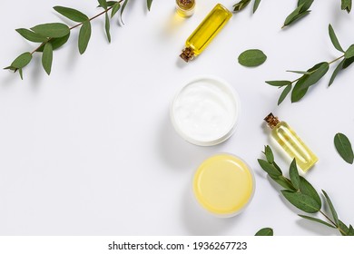 Organic Skin Care Products On White Background With Fresh Green Eucalyptus Twigs.