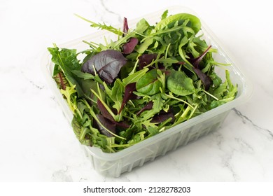 Organic Spring Mix Lettuce. Mixed Salad Greens. Fresh Green Salad With Spinach, Arugula, Romaine And Lettuce In A Container.