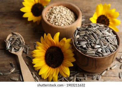 Organic sunflower seeds and flowers on wooden table