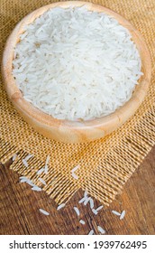 Organic Thai Jasmine Rice Grain In Wooden Bowl Preparing For Cooked