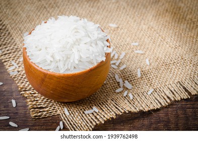 Organic Thai Jasmine Rice Grain In Wooden Bowl Preparing For Cooked