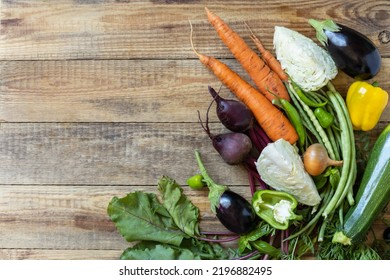 Organic Vegetables For Healthy Cooking Background. Fall Harvest. The Concept Of Vegan Or Diet Food. Various Vegetables On A Rustic Kitchen Table. View From Above. 