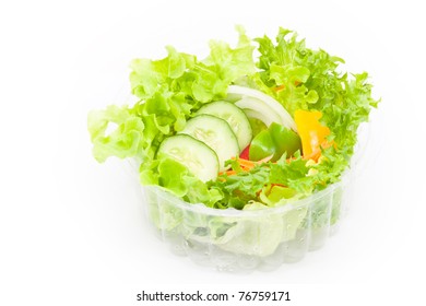 Organic Vegetables Salad In Plastic Bowl On White Background