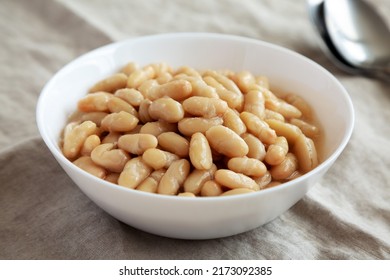 Organic White Cannellini Beans In A White Bowl, Side View. 