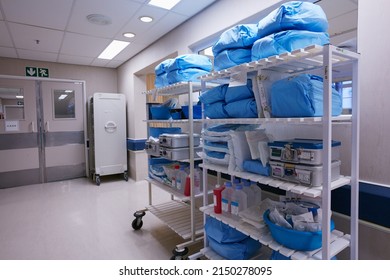 Organization Is Essential To Running A Hospital. Shot Of Shelves Stocked With Medical Supplies In An Empty Hospital Ward.