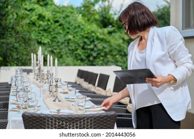 Organization of weddings, parties, catering for events. Female on the background banquet decorated table, table setting decoration - Powered by Shutterstock