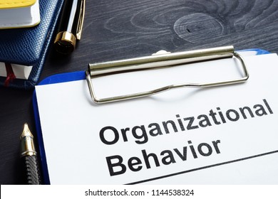 Organizational Behavior Report On An Office Desk.