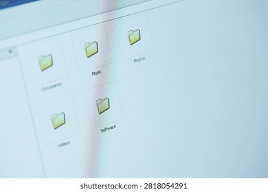 Organized Computer Folders On Screen Showing Documents Music Photos Videos And Software File Icons