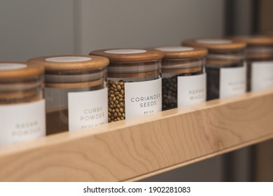 Organized, labeled food pantry in kitchen with spices, grains, flours, and rice - Shutterstock ID 1902281083