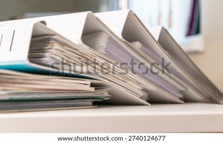 Organized office binders with documents
