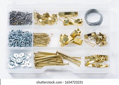 Organized Picture Hanging Hardware Kit With Nails, Screws, Hooks, And Wire.