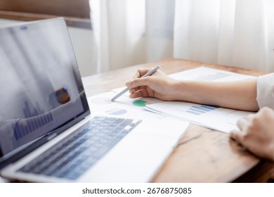 Organized stack of business documents and paperwork on office desk, representing planning, financial analysis, management, efficiency, responsibility, and deadline-focused professionalism.