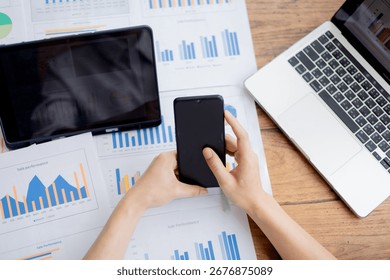 Organized stack of business documents and paperwork on office desk, representing planning, financial analysis, management, efficiency, responsibility, and deadline-focused professionalism.