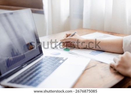 Organized stack of business documents and paperwork on office desk, representing planning, financial analysis, management, efficiency, responsibility, and deadline-focused professionalism.