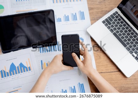 Organized stack of business documents and paperwork on office desk, representing planning, financial analysis, management, efficiency, responsibility, and deadline-focused professionalism.