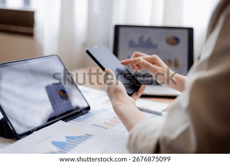 Organized stack of business documents and paperwork on office desk, representing planning, financial analysis, management, efficiency, responsibility, and deadline-focused professionalism.