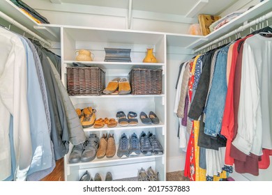 Organized Unisex Small Walk In Closet Interior With Shoe Rack In The Middle