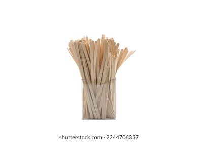 Organizer with coffee stirrers on isolated background