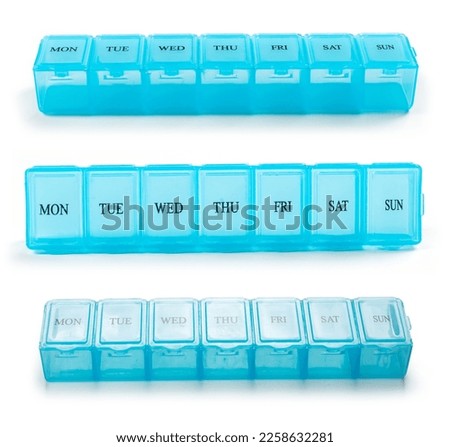 Organizer for medical pills on a white isolated background close-up. Organization of taking pills of the day
