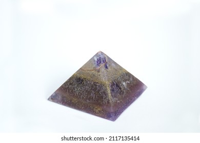 Orgonite, Resin Pyramid With Copper Spiral Transparency, Amethyst Tip And Capable Of Metals. Electromagnetic Frequency Neutralizer On White Background