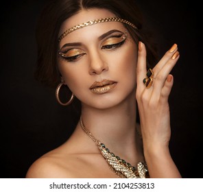 Oriental beauty. Beautiful girl with golden make-up. A beautiful model. The golden girl. 