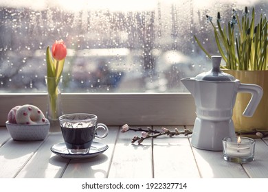 Oriental Coffee In Traditional Copper Coffee Pot With Flowers On Window Sill. Wooden Windowsill With Orange Tulips And Hyacinth Flower Pot. Cold Rainy Day In Spring. Cozy Scene, Hygge Concept.