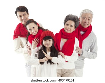 The Oriental Family Celebrate The New Year, A Girl Standing Front With Chinese Baoquan Greetings, Congratulations To Get Rich Gestures