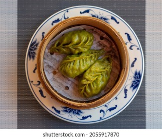 Oriental Green Dumplings In A Traditional Bamboo Steamer. Top View.