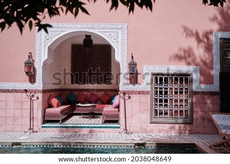 Oriental hospitality. Traveling by Morocco. Relaxing in festive moroccan traditional riad interior in medina.