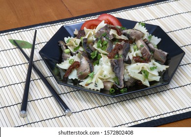 Oriental Salad With Bowtie Pasta, Mushrooms, Tomato And Scallions