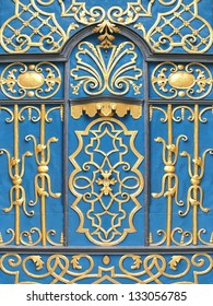 Oriental wrought iron ornament door in blue and gold.
