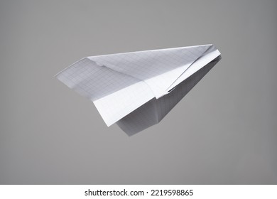 Origami Airplane Made Of Checkered Notebook Paper