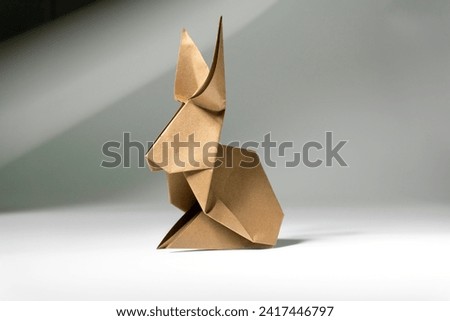 Origami bunny. rabbit made of paper on a white background.Origami. Paper art. Paper crafts
