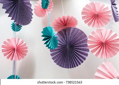 Origami Fans Wheel - Paper Craft Folding And Hanging Against White Wall For Decorative Backdrop.